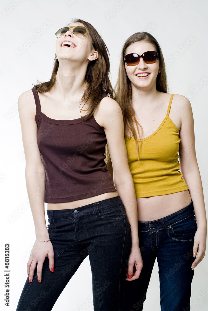 Two happy young pretty girls in sunglasses Two happy young pretty girls in sunglasses