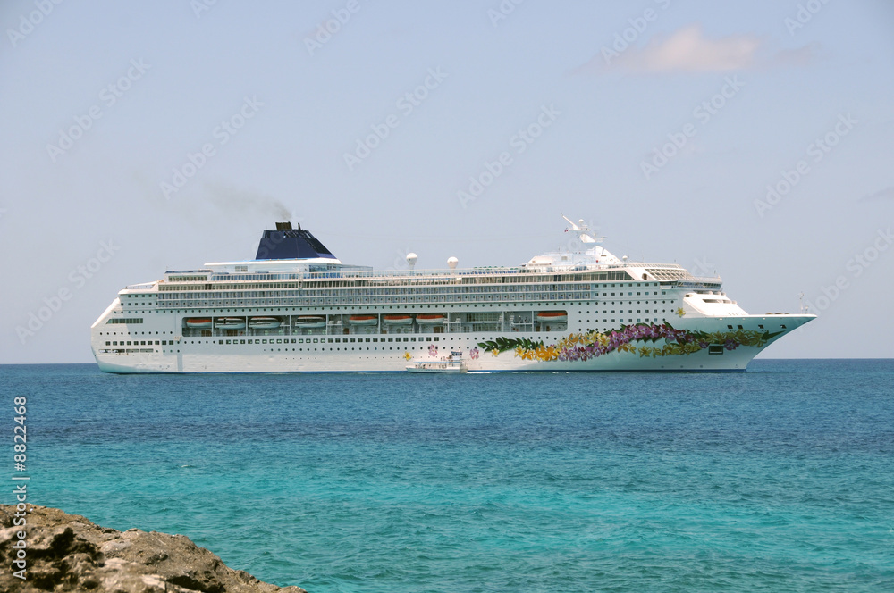 Modern ocean liner visiting an island in the Caribbean