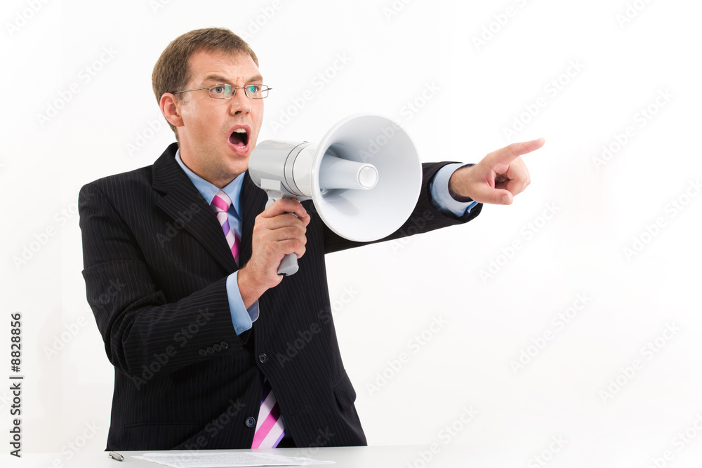 Portrait of unhappy man speaking through megaphone Portrait of unhappy man speaking through megaphone