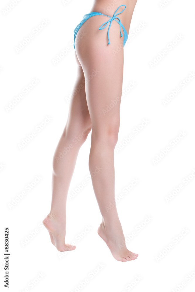 Beautiful female legs isolated on a white background