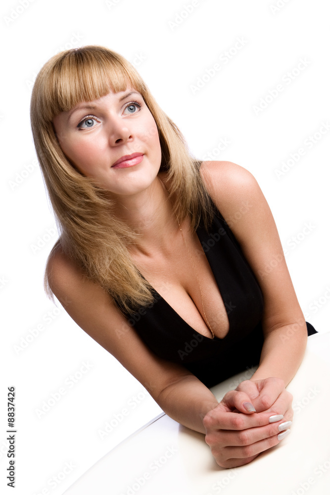 Young businesswoman sitting at table, isolated on white Young businesswoman sitting at table, isolated on white