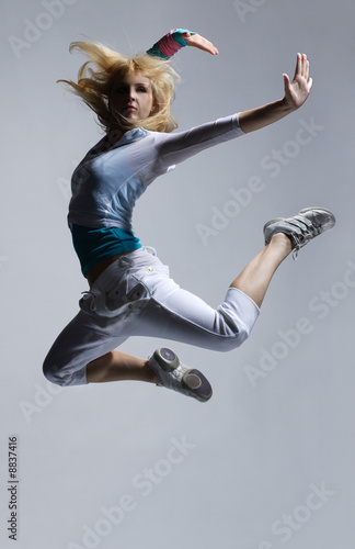 Fototapeta Naklejka Na Ścianę i Meble -  stylish and cool looking breakdancer jumping