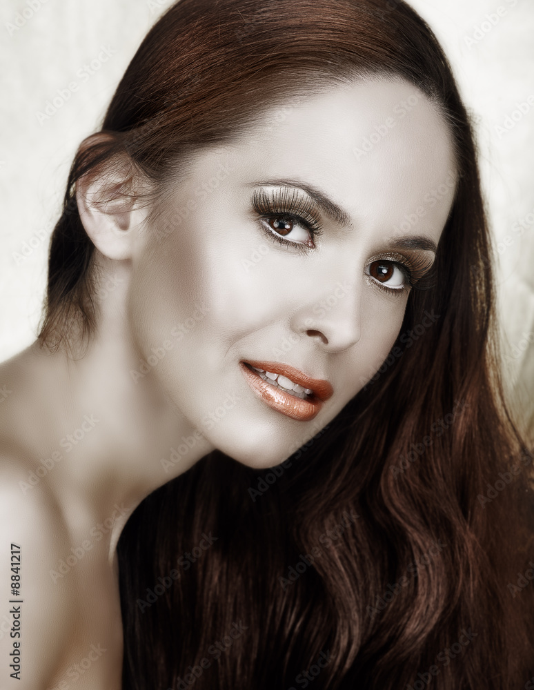 Fototapeta premium beautiful woman with long brown hair and long false lashes.