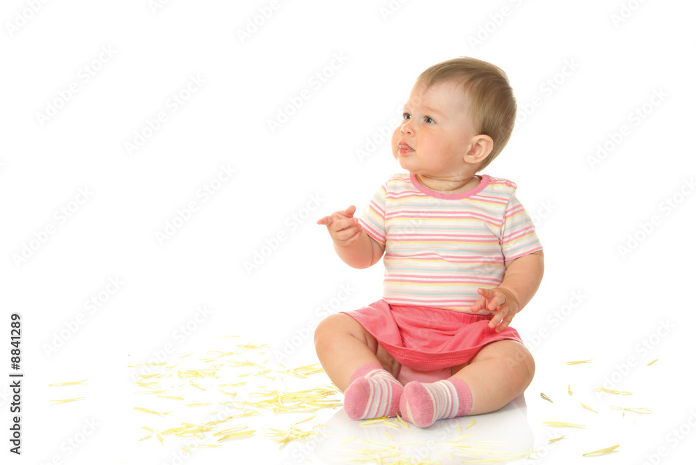 Sitting small baby with yellow petals isolated Sitting small baby with yellow petals isolated