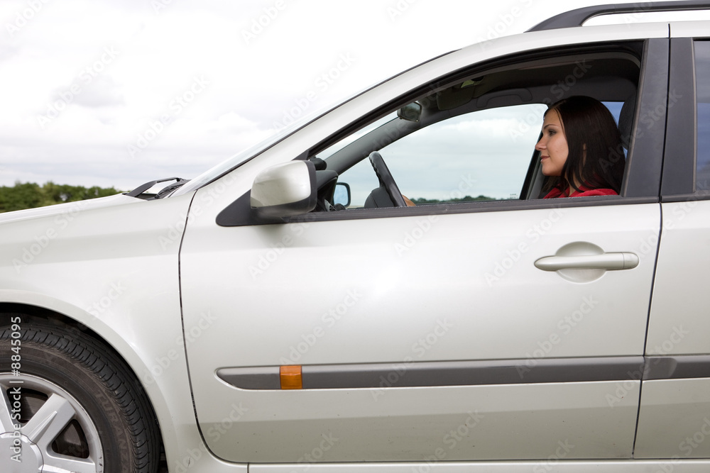 attractive brunette woman traveling by car