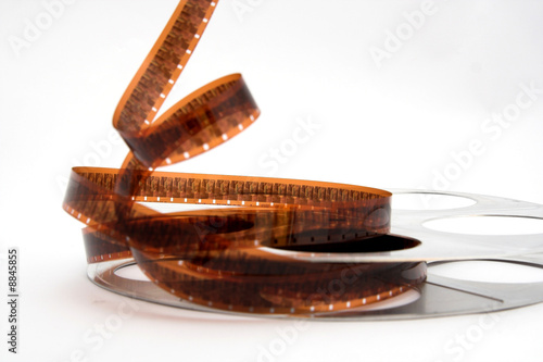 Vintage movie film and reel on white