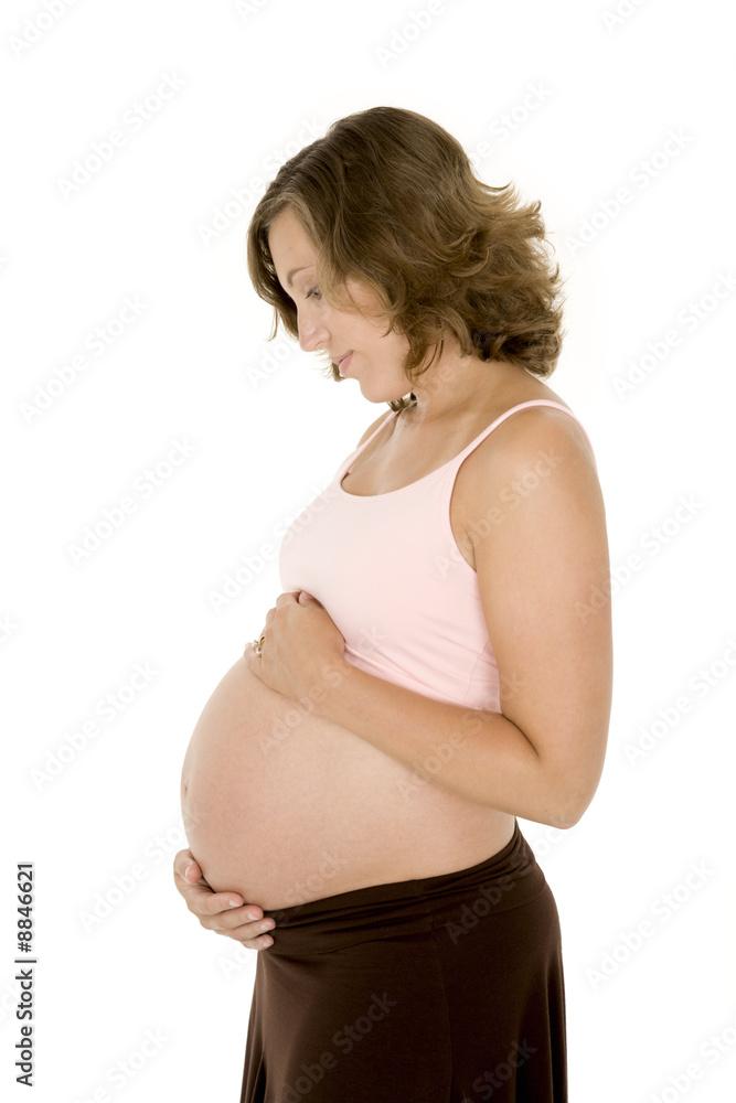 Caucasian woman who is 9 months pregnant on white background Caucasian woman who is 9 months pregnant on white background
