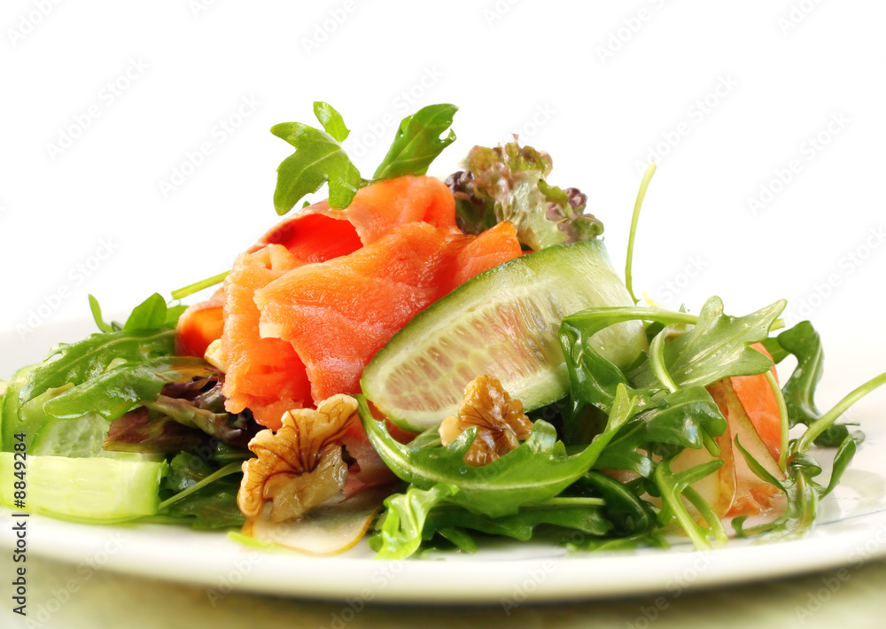 Salad with smoked salmon, walnuts, pears, cucumber and rocket. Salad with smoked salmon, walnuts, pears, cucumber and rocket.
