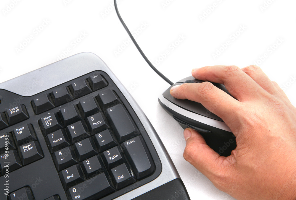 Isolated ergonomic keyboard and hand on mouse Isolated ergonomic keyboard and hand on mouse
