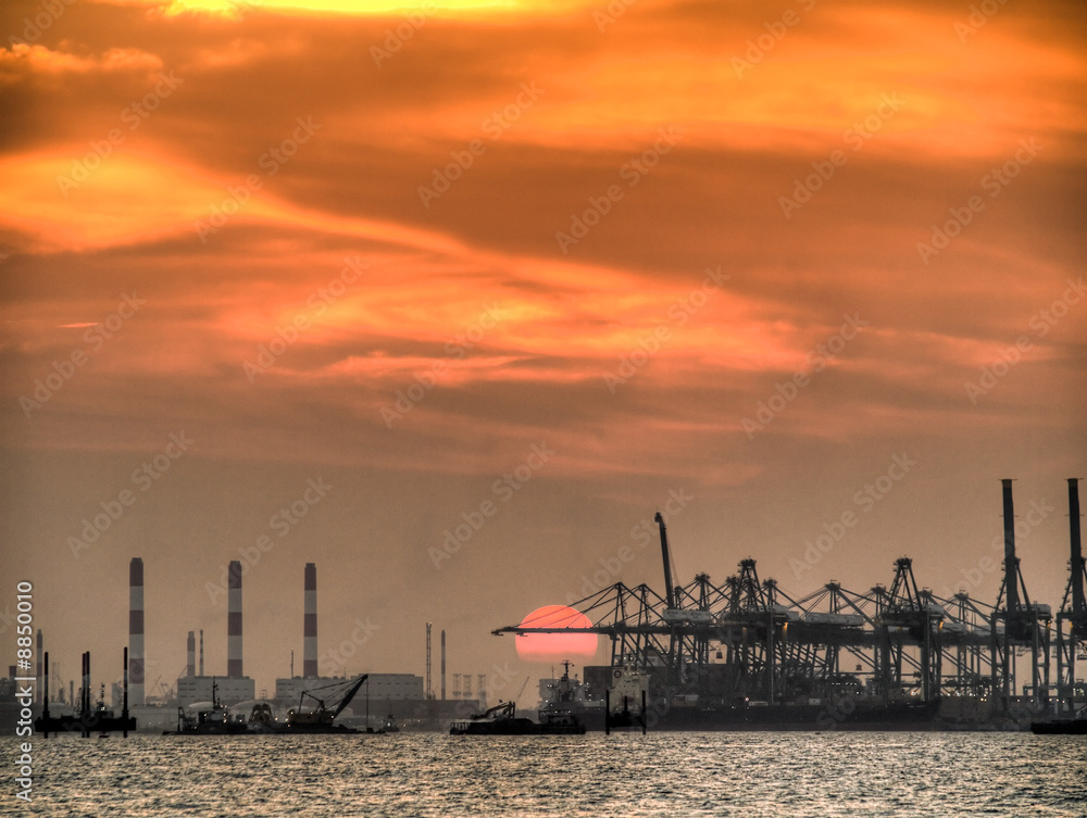 Sunset over a Port and a Petrochemical Complex