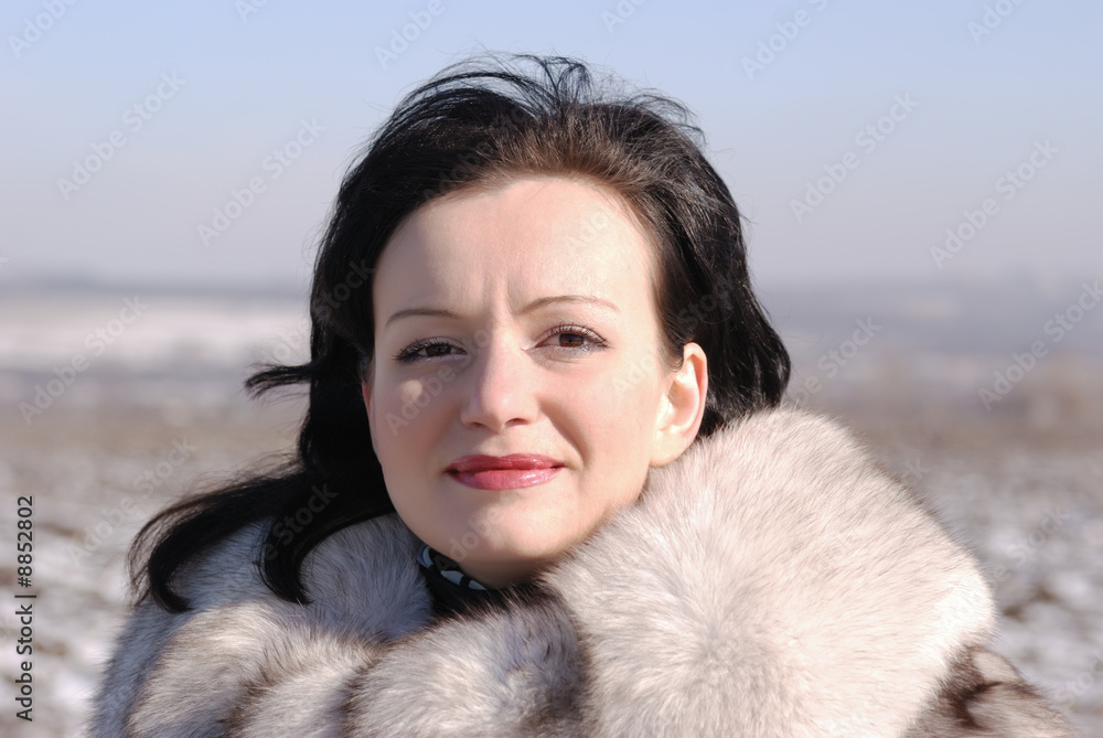 The woman in a fur coat. A fur coat from arctic fox