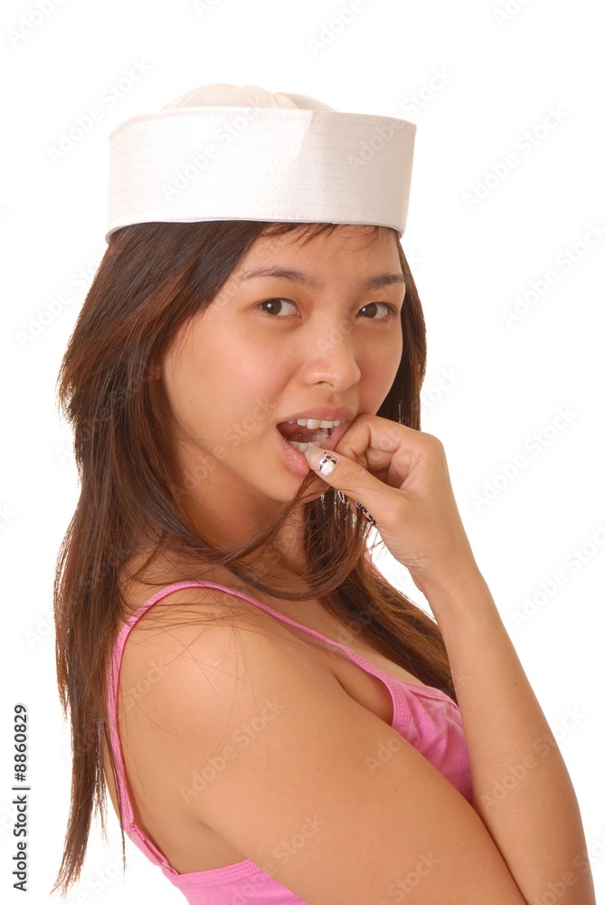 Fototapeta premium Beautiful young Asian girl wearing a sailor's cap