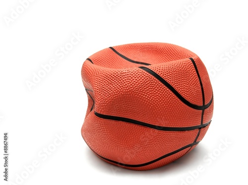 Soft, broken basketball isolated on white