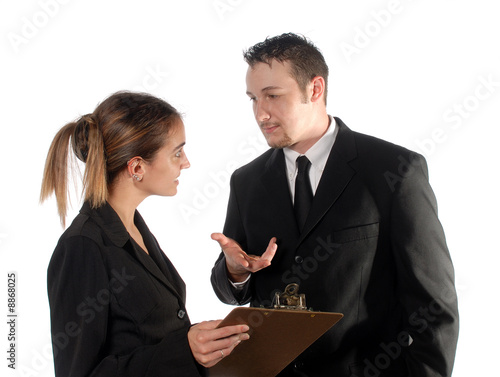 Office managers in a discussion over progress.