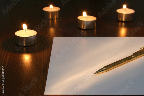Pen for making a note, with candles