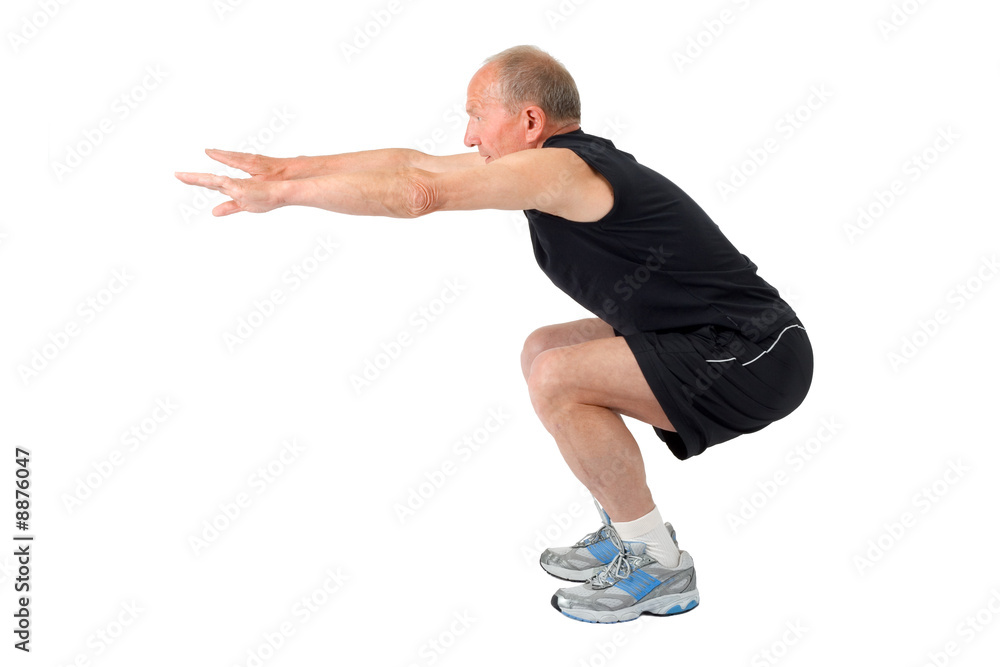 Fit senior man doing a squat
