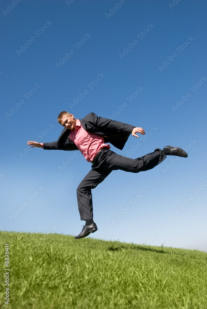 flying businessman against blue sky flying businessman against blue sky