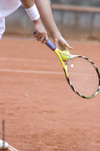 Tennis player is serving © L.F.otography