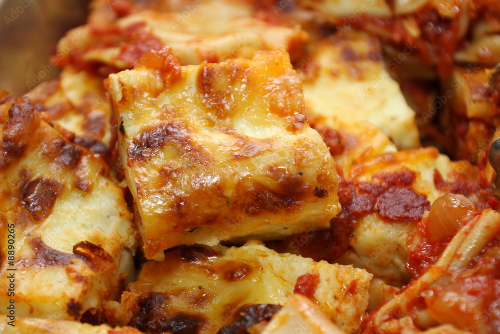 Piece of Lasagna in a pan