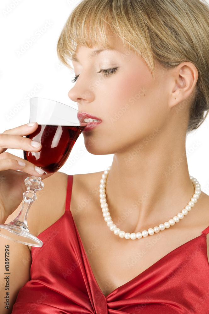 an elegant blond girl with necklace drinking red wine an elegant blond girl with necklace drinking red wine