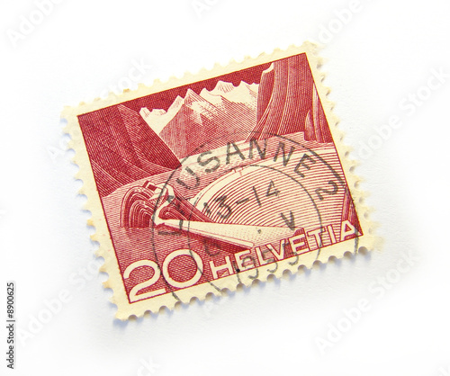 Old postage stamp from Switzerland on white background.