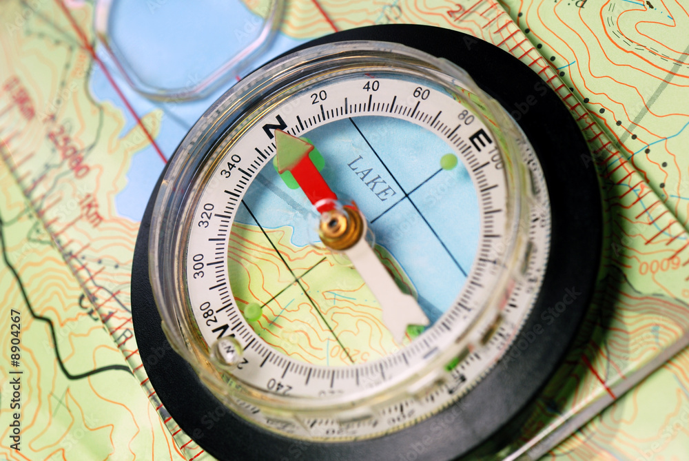 Navigational Compass on Topographical Map, Pointing North Navigational Compass on Topographical Map, Pointing North