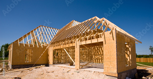 Fényképezés A new home being built with wood,