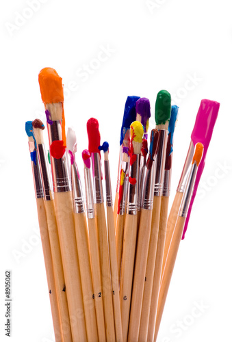 A group of multi-color painbrushes on a white background