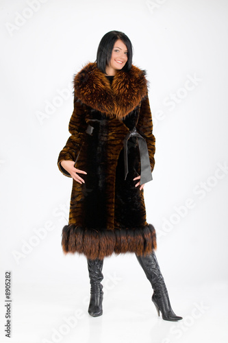 Young attractive woman in furcoat