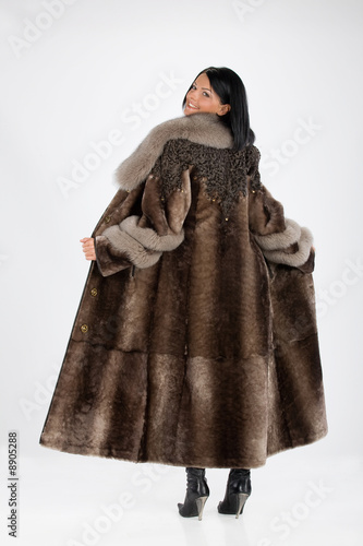 Young attractive woman in furcoat