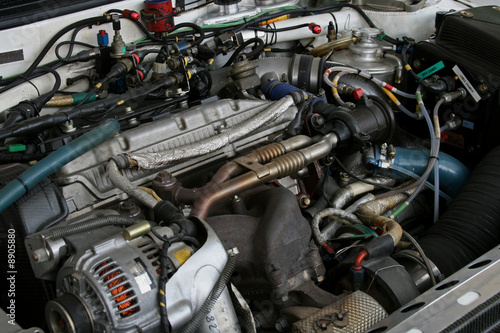exposed racing car engine under the hood © Christopher Nolan