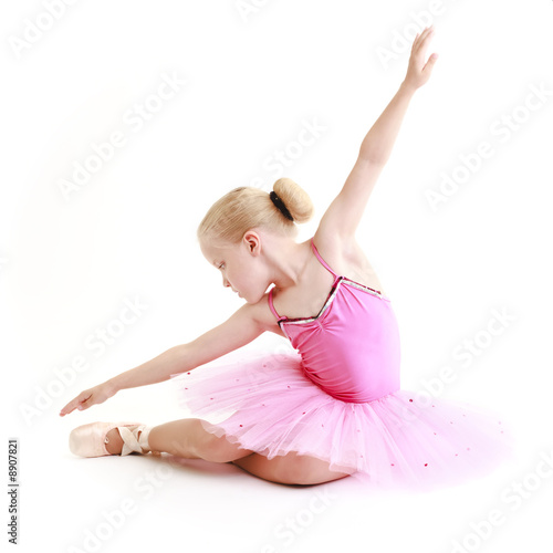 Young ballerina dancer over a white background