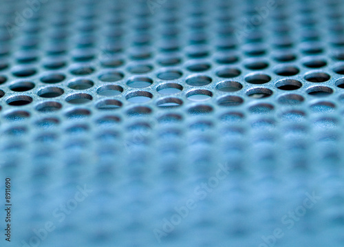 Macro picture of a metallic grid blue tinted