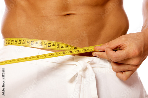 Muscular and tanned male body parts is being measured