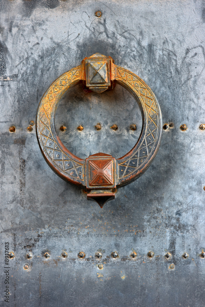 Door knocker of ancient castle gate Door knocker of ancient castle gate