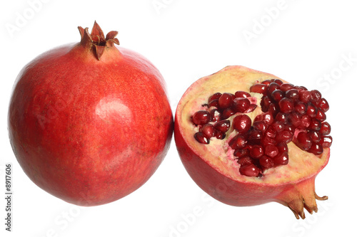 Pomegranate fruit and a half, isolated on white background