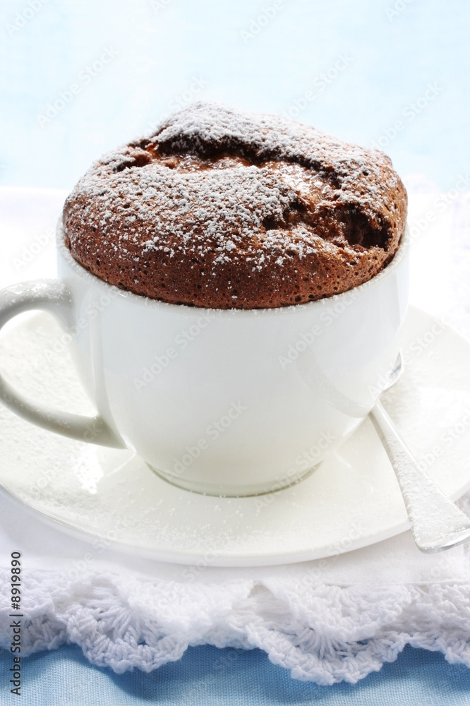 Chocolate souffle served in a white coffee cup