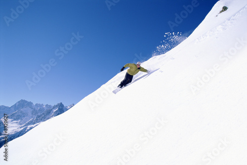 Young woman snowboarding