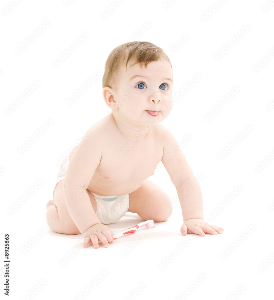 baby boy in diaper with toothbrush sticking tongue out baby boy in diaper with toothbrush sticking tongue out