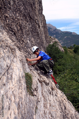 child rock climbing