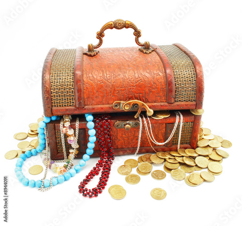 old wooden trunk with money and jewellery isolated