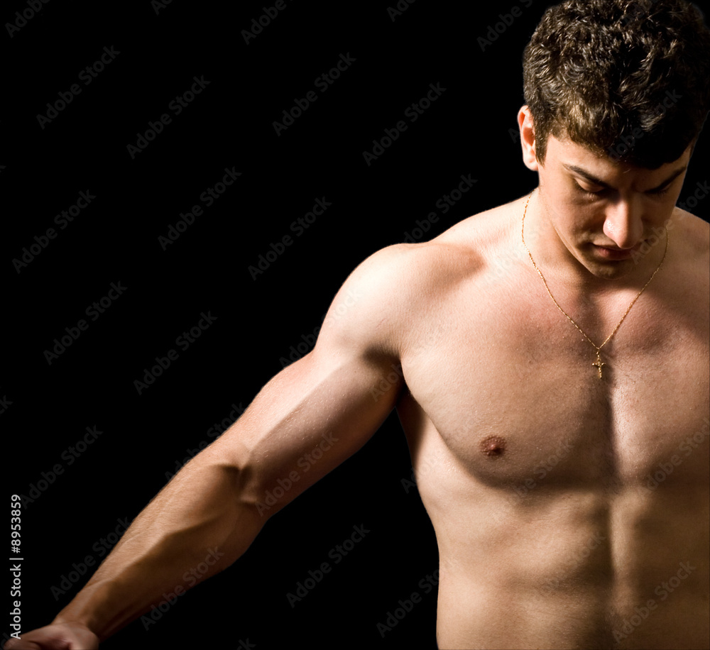 Muscular man with strong arms and nice abs