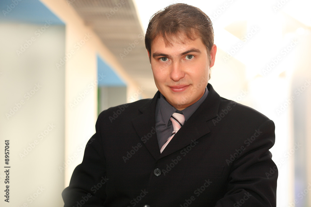 Business background: handsome businessman in a work process. Business background: handsome businessman in a work process.