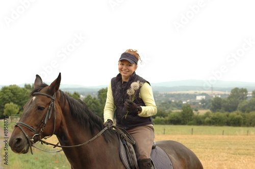 Smiles horsewoman with Dandelion.