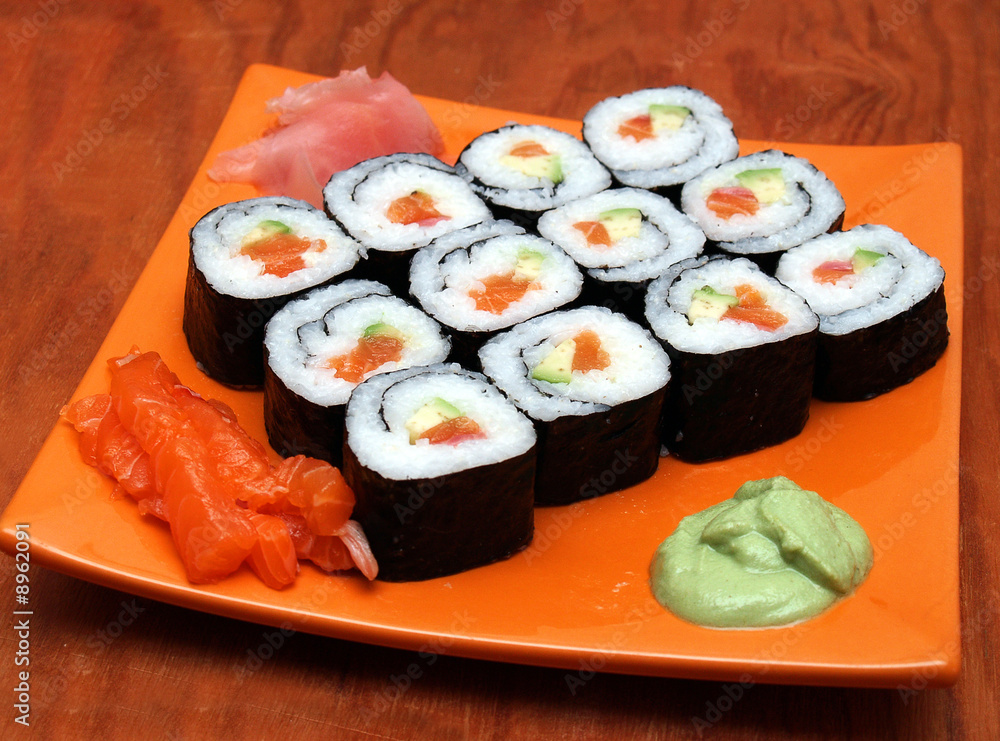 sake avocado maki sushi on orange tray, wasabi, ginger sake avocado maki sushi on orange tray, wasabi, ginger