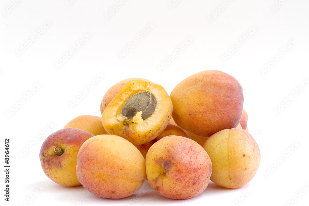 Fresh appetizing apricots on a white background Fresh appetizing apricots on a white background