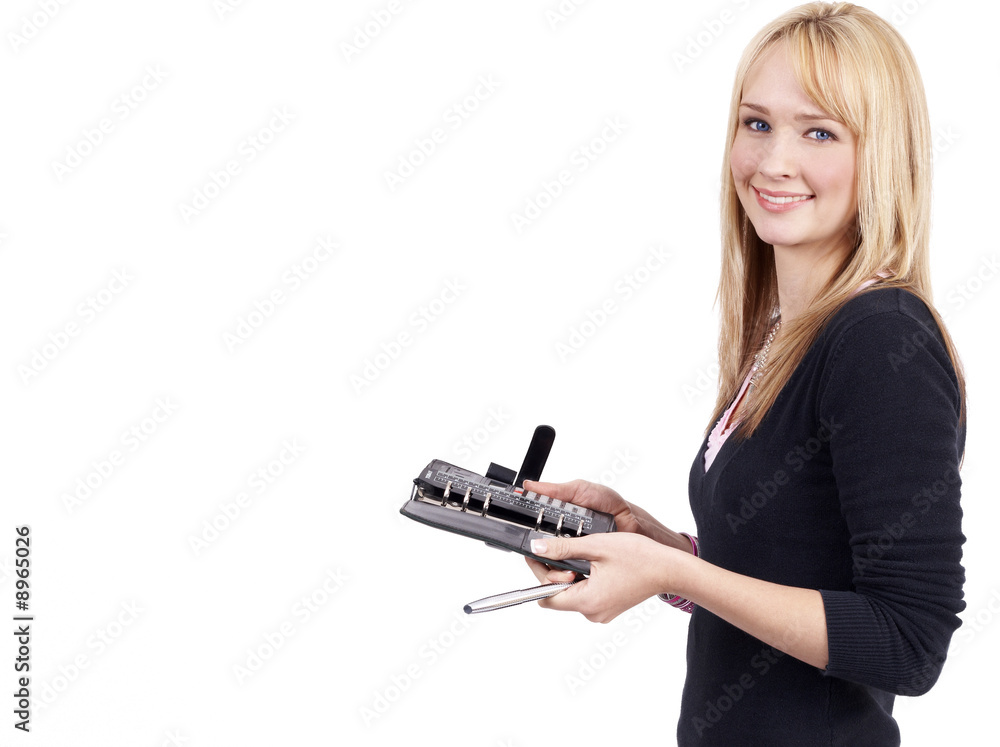 Beautiful blonde businesswoman holding her diary and a pen Beautiful blonde businesswoman holding her diary and a pen