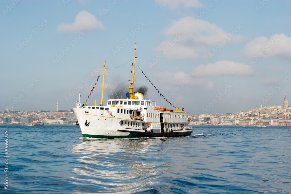 A passenger boat makes a trip in Istanbul