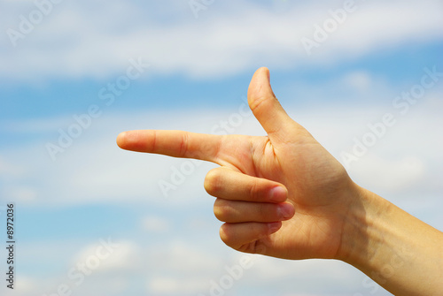 hand pointing with index finger against a white background