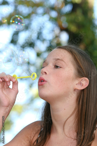 Portrait of a Young Girl Blowing Bubbles